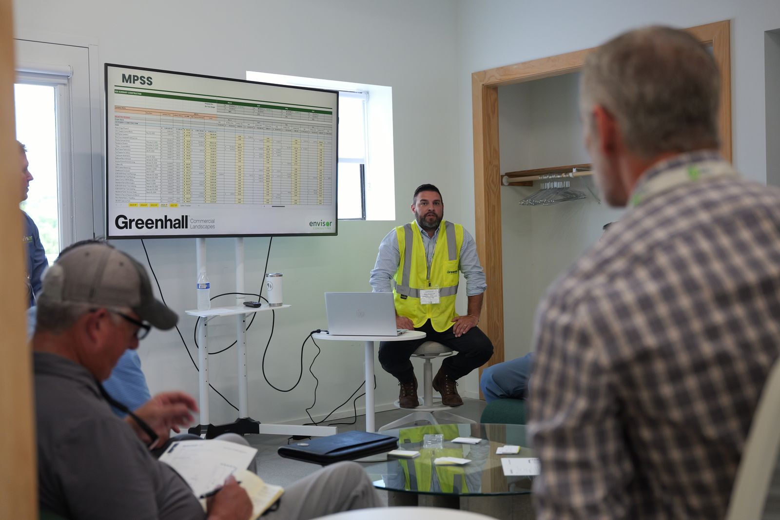 Attendees inside Greenhall reviewing live business systems during Envision 2026